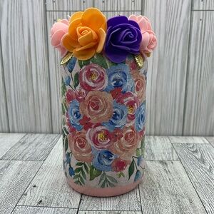 Beautiful spring decoration of a jar with handmade flowers.